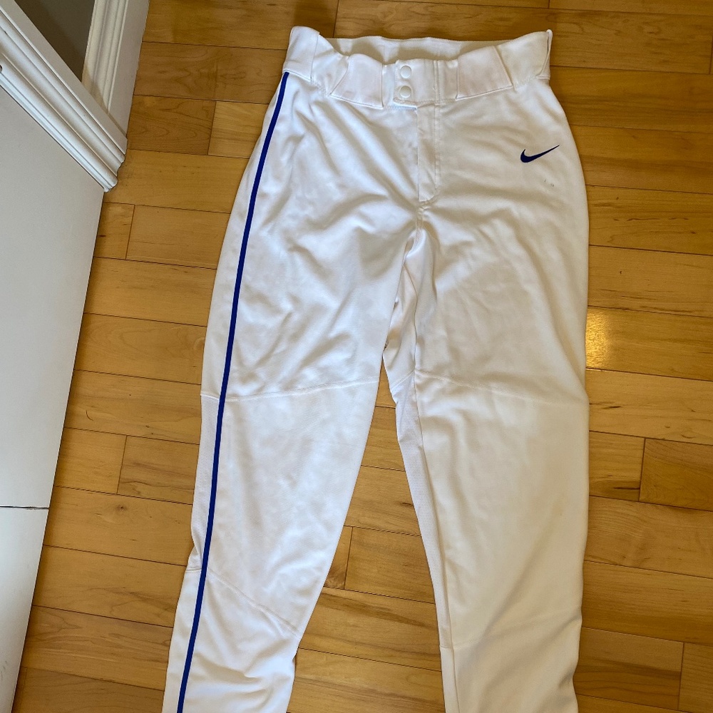 USED - MEN'S NIKE VAP0R BASEBALL PANTS SIZE SMALL WHITE WITH BLUE PIPING
